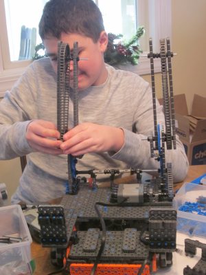 boy building a robot